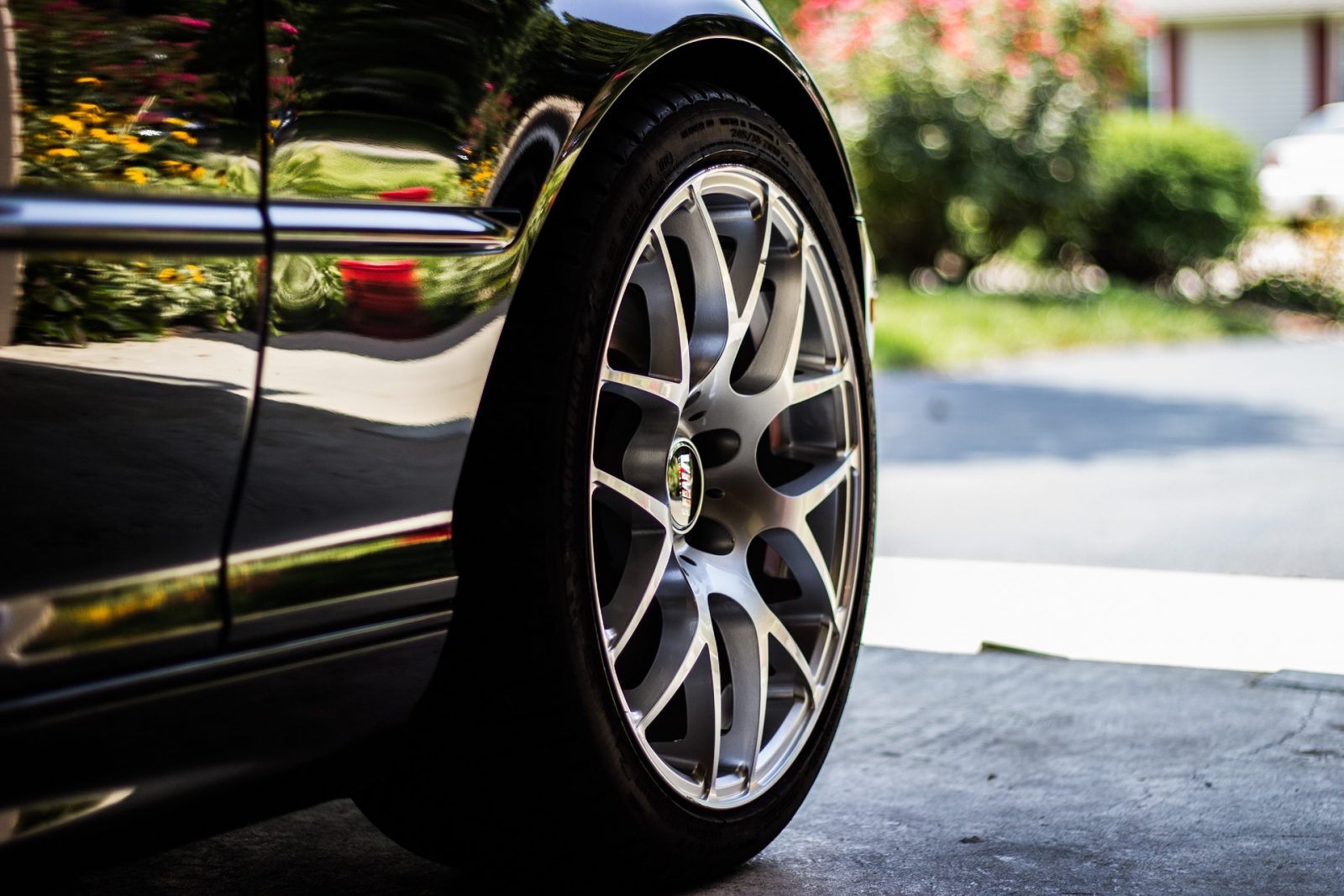 closeup of a car tire, VMR wheels, car parked in home garage